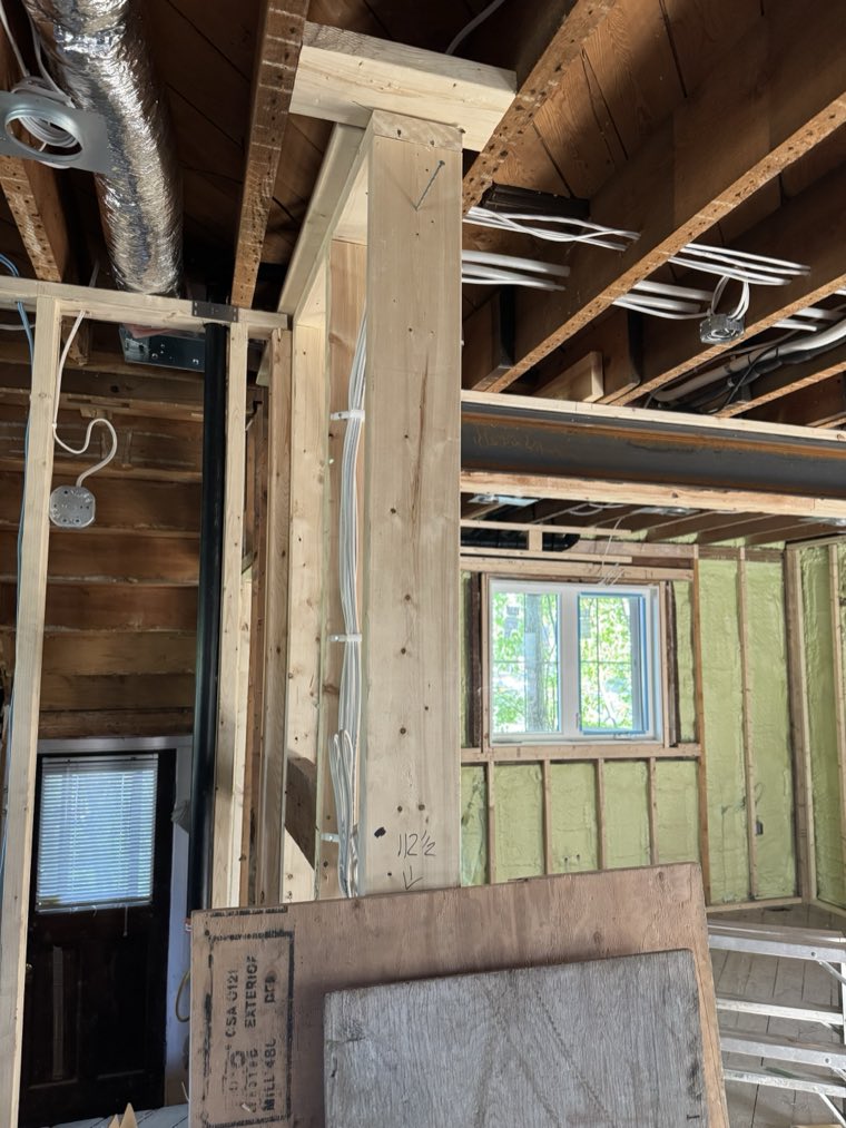 A new structural post and beam framed into an older house